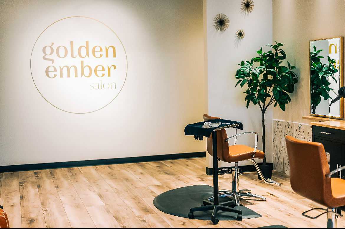 Interior of Golden Ember Salon with chairs and plants.